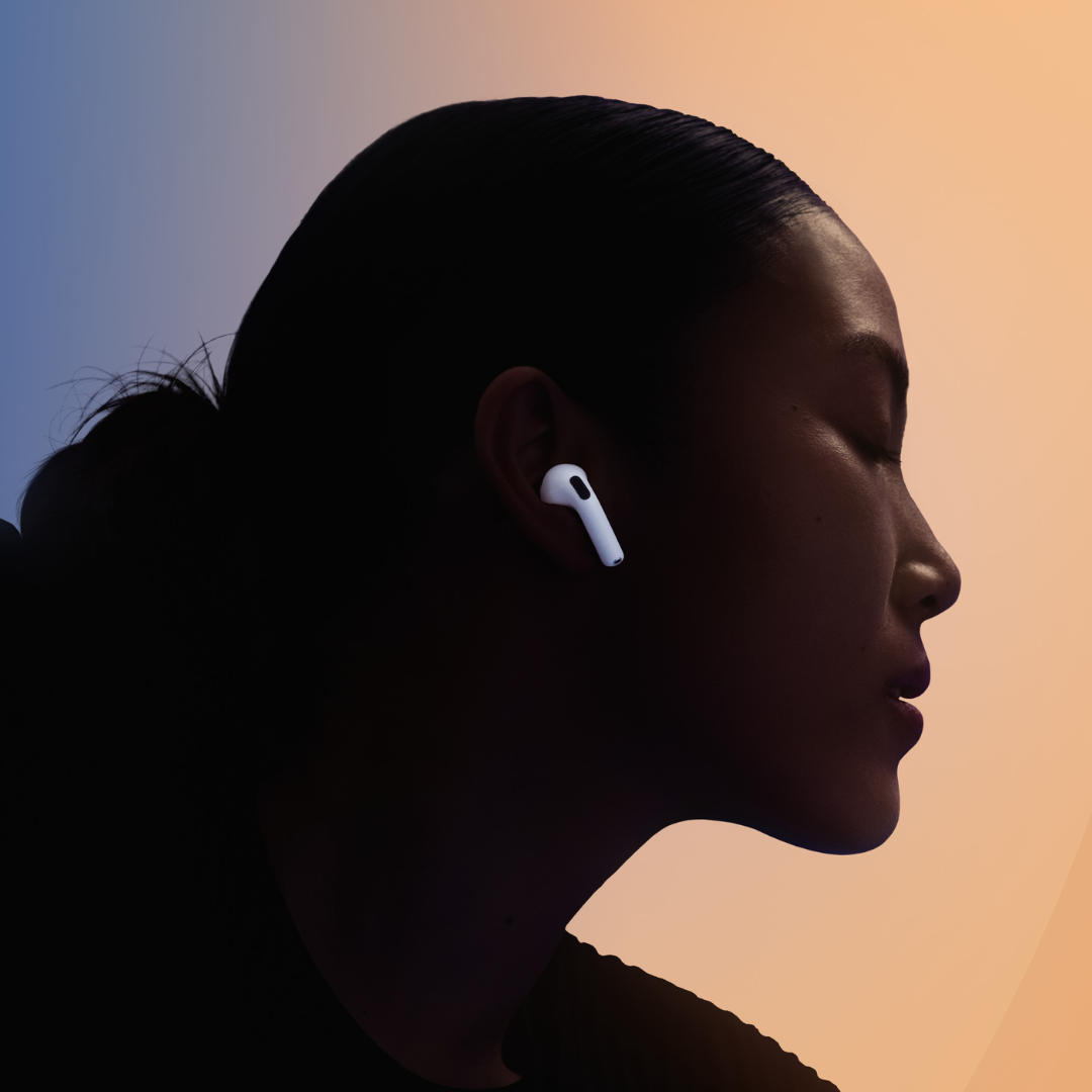 Active Noise Cancellation for Immersive Sound Person wearing AirPods 4 in a noisy urban environment, enjoying Active Noise Cancellation.